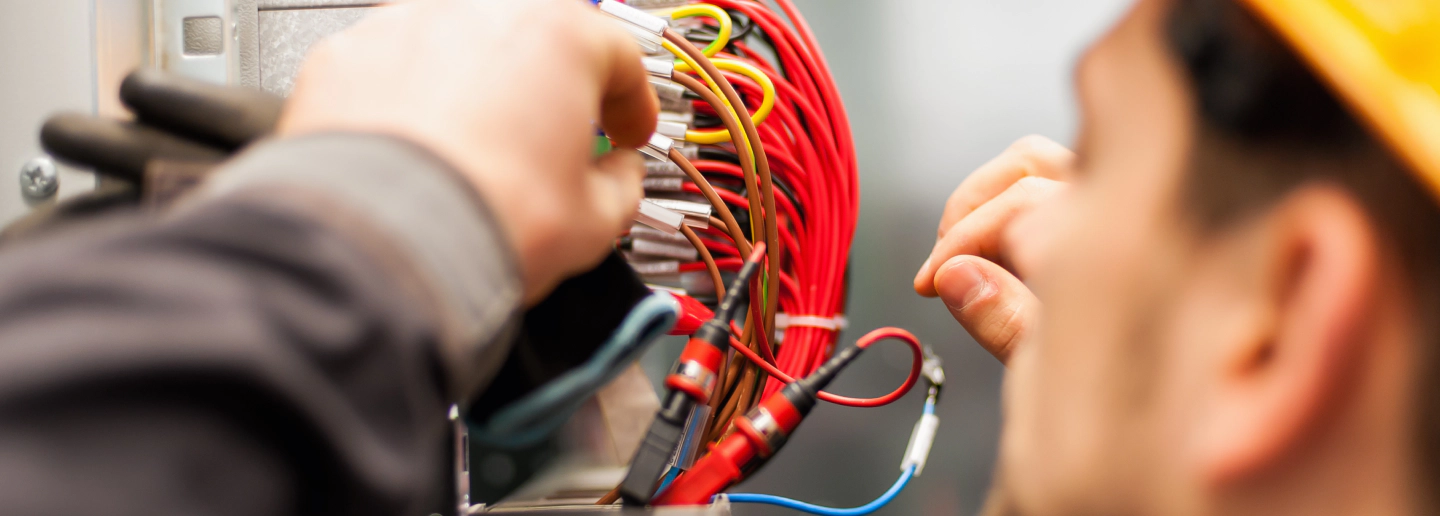 electrician working on rewiring in a house newport mi